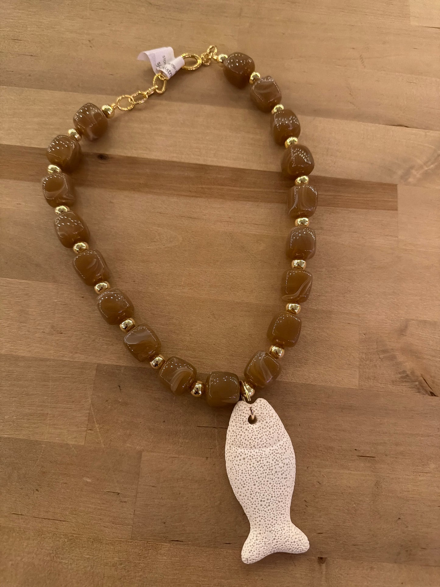 Light brown agate beaded necklace with gold accents and white lava stone fish pendant