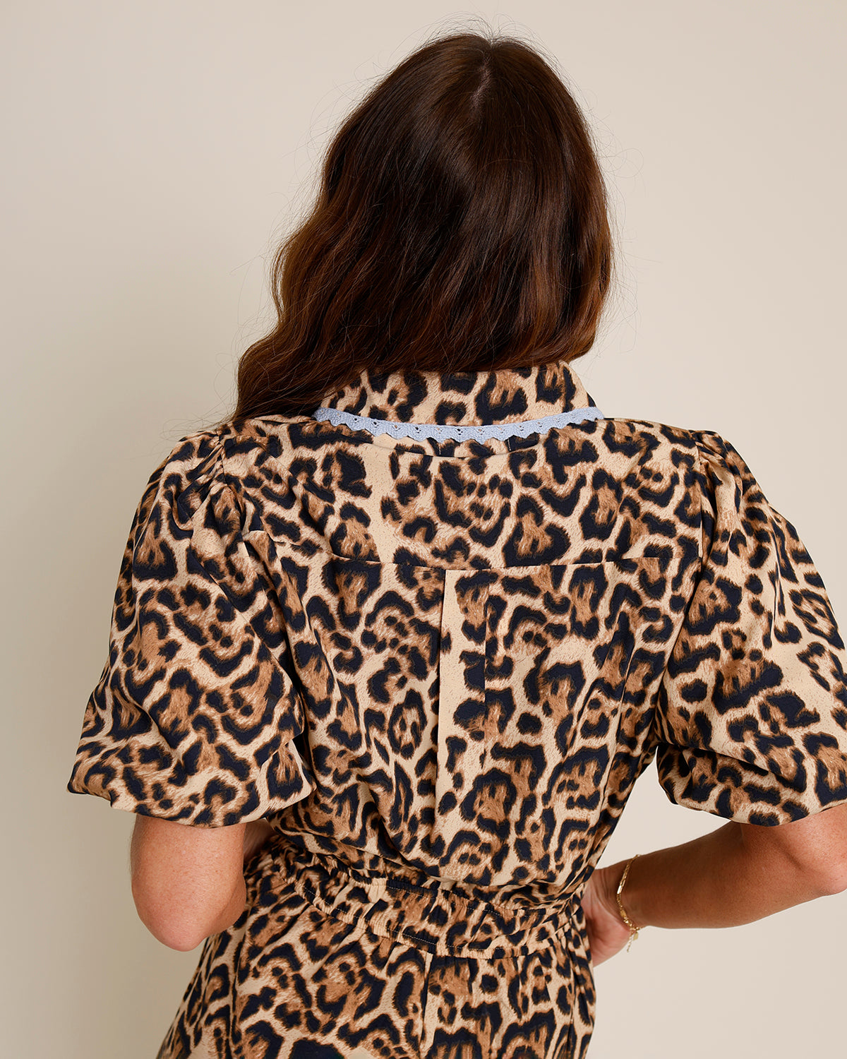 leopard print romper with blue lace trim and pockets