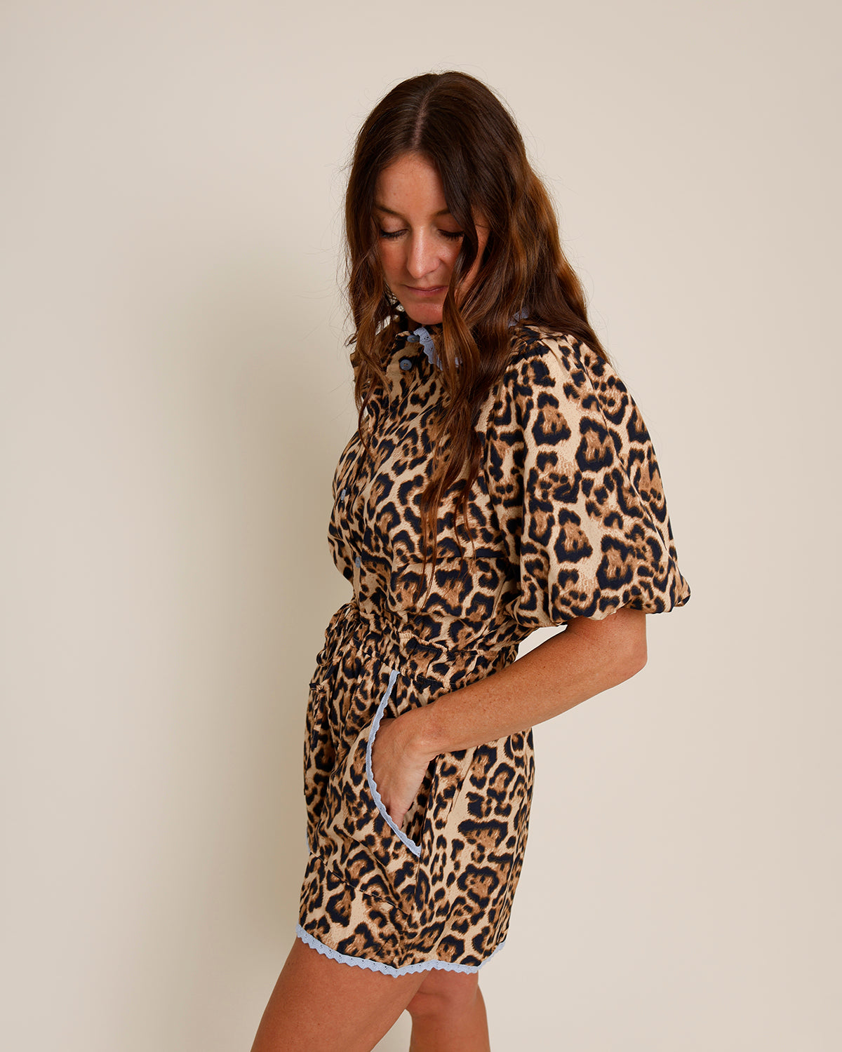 leopard print romper with blue lace trim and pockets