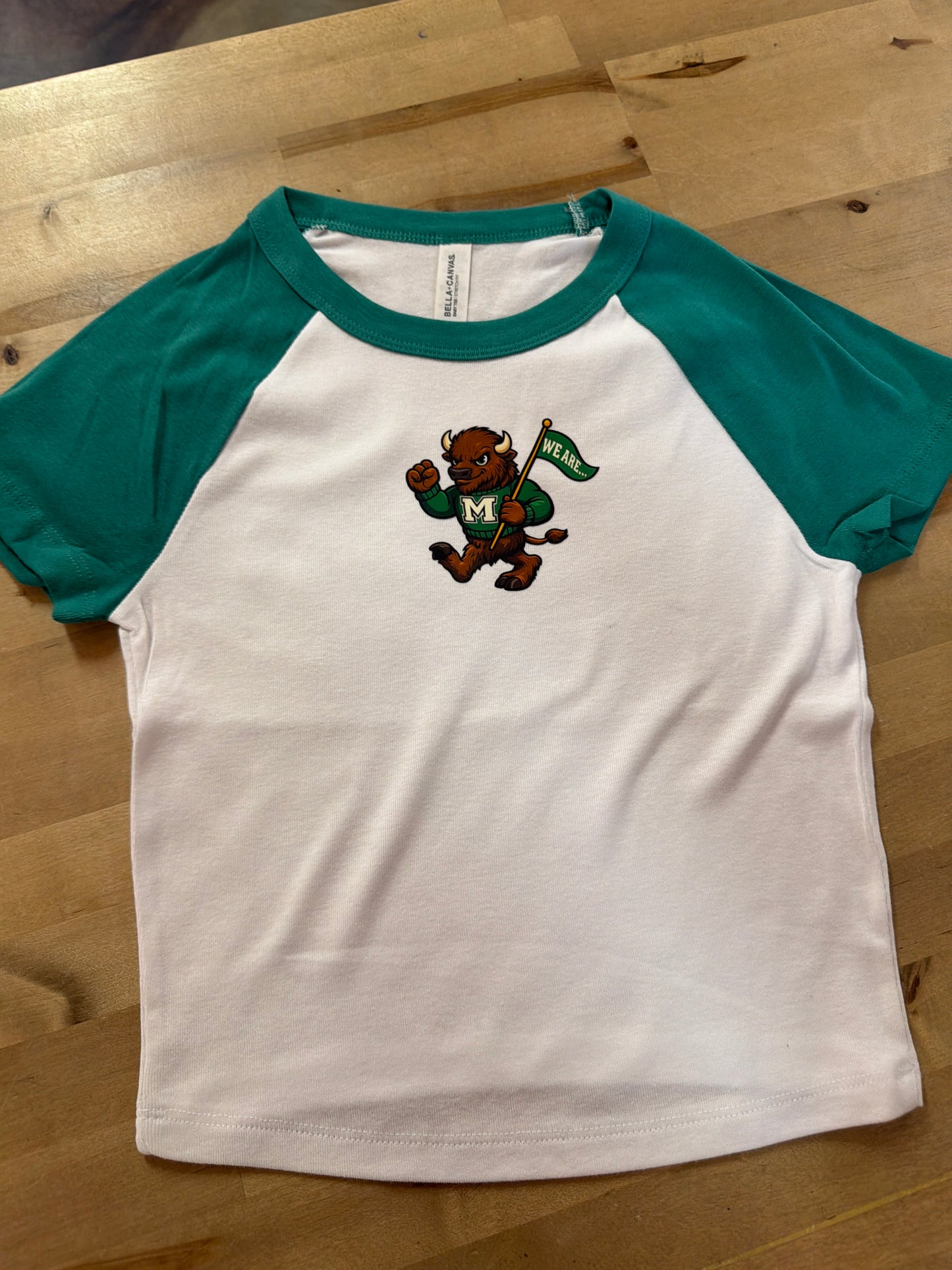 White raglan baby tee with teal sleeves and Marshall University bison mascot graphic