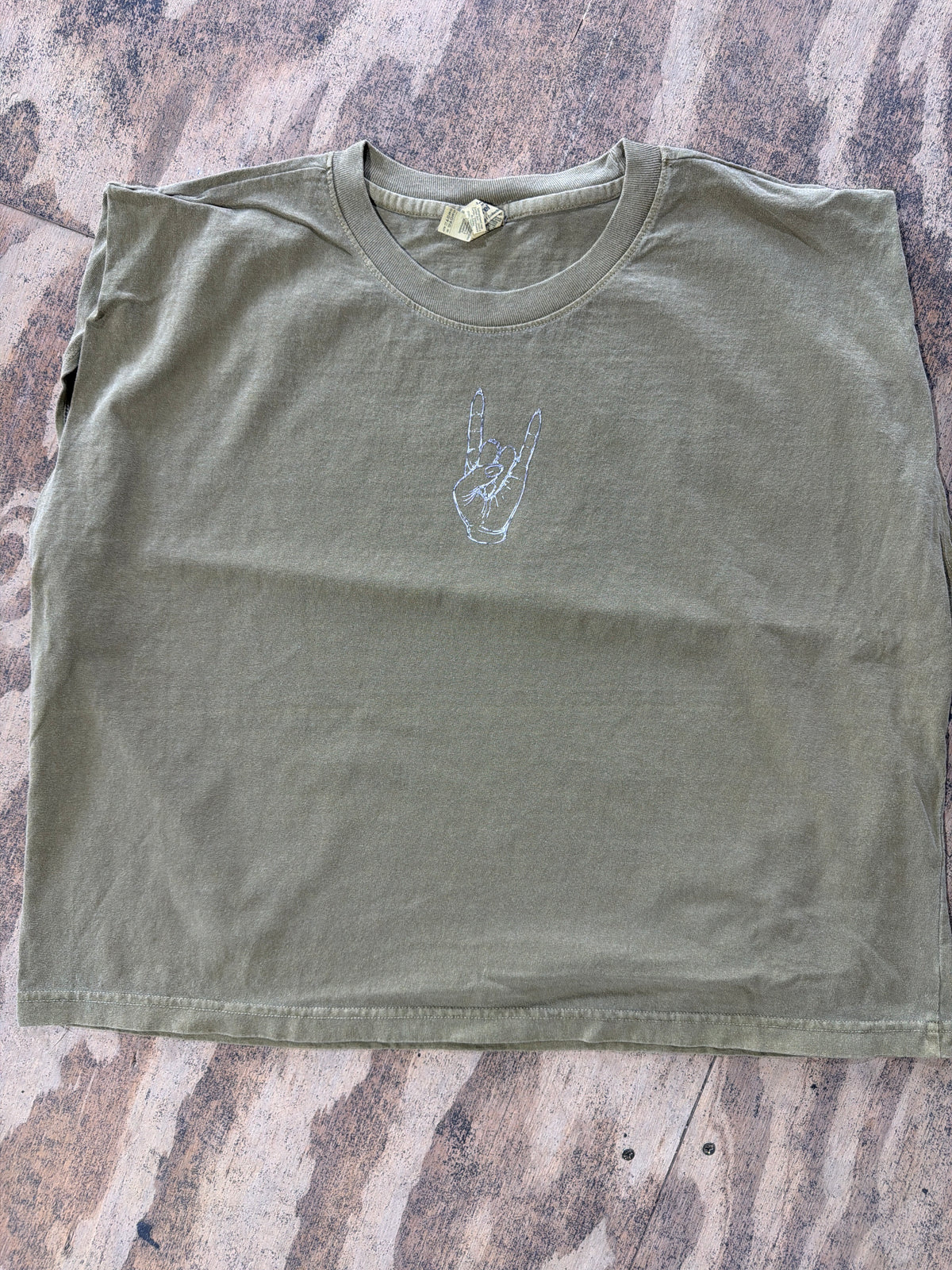 Olive green muscle tee with silver Herd hand graphic on chest