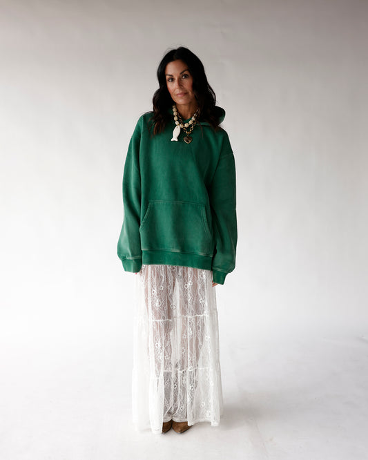 Oversized green hoodie with kangaroo pocket, styled with white lace maxi skirt
