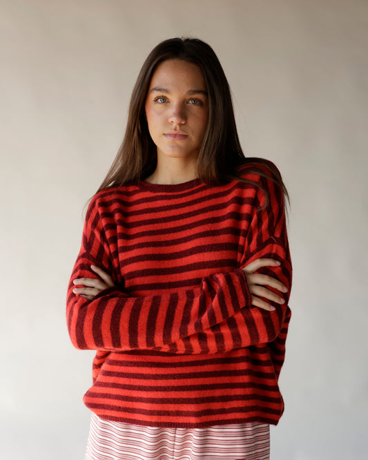 Red and burgundy striped oversized crewneck sweater with long sleeves