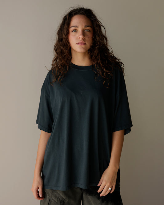 daydreamer vintage black oversized t-shirt with a washed charcoal finish, ribbed crew neckline, dropped shoulders and relaxed short sleeves.