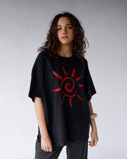 washed black short sleeve tee with red sun graphic