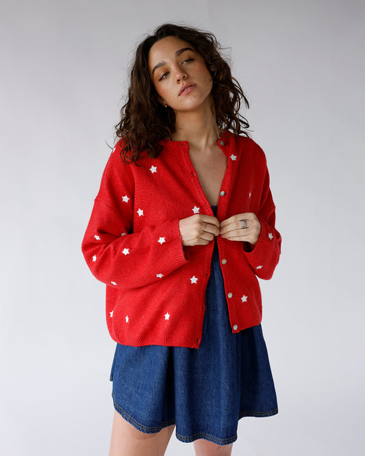 red long sleeve button front cardigan with all over white embroidered stars
