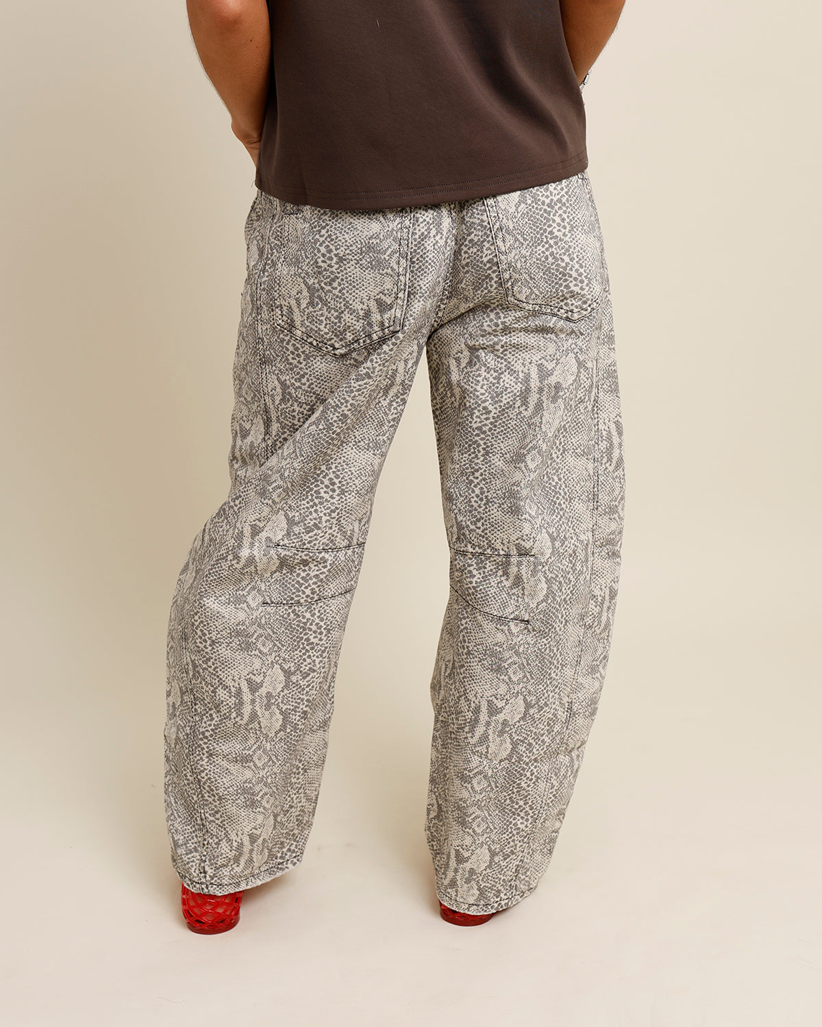 FREE PEOPLE GOOD LUCK SNAKE PRINT BARREL JEANS