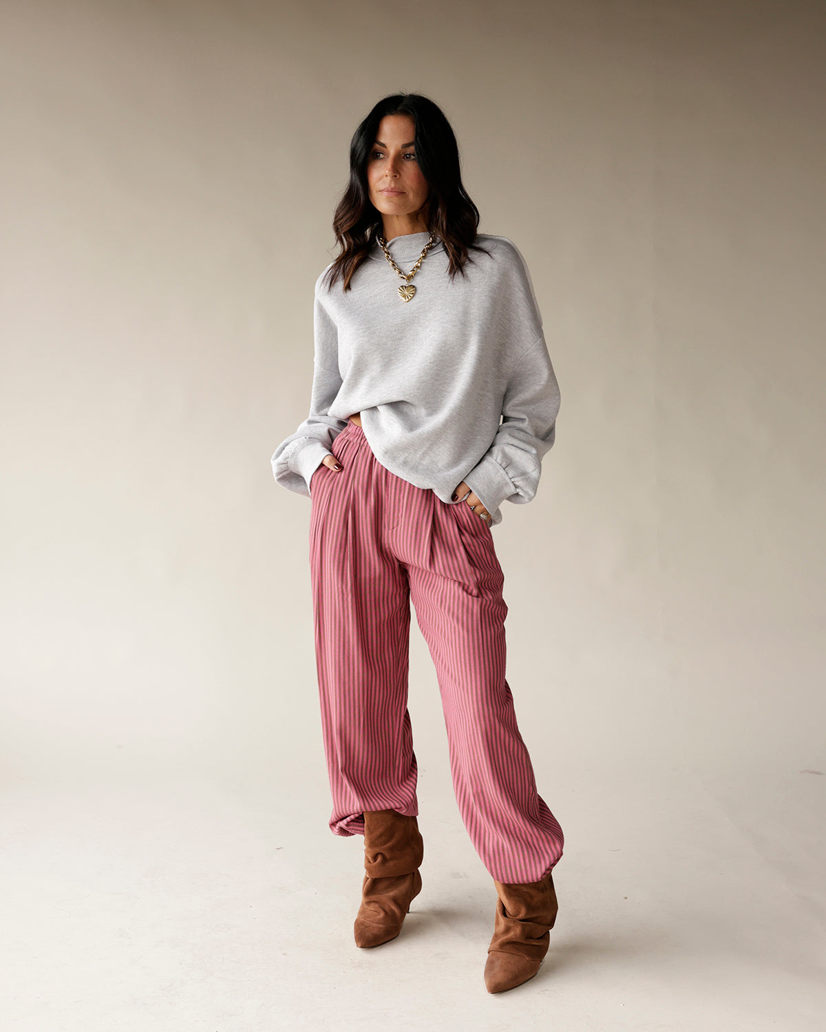 Pink striped wide-leg dressy pants with pleated front and relaxed silhouette