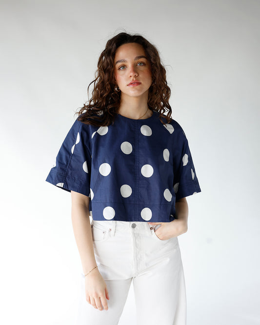 navy blue and white polka dot short sleeve back tie detail top