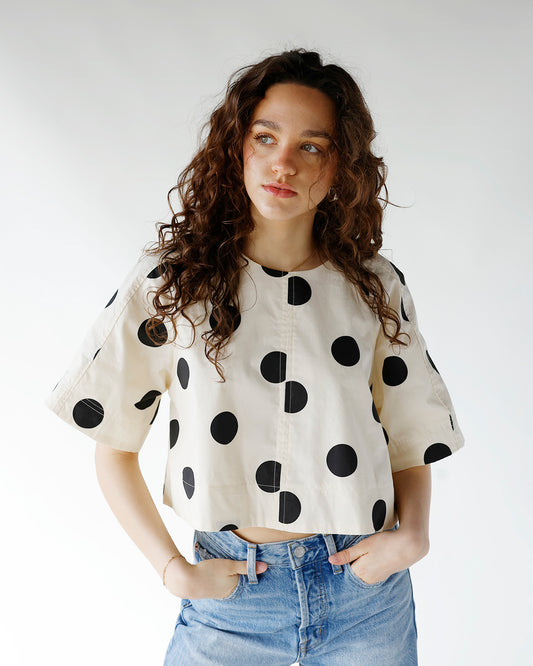 cream and black polka dot print short sleeve top with open back tie details