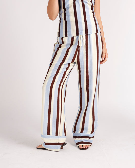 Wide-leg striped pants in blue, cream, and burgundy with drawstring waist and cuffed hem