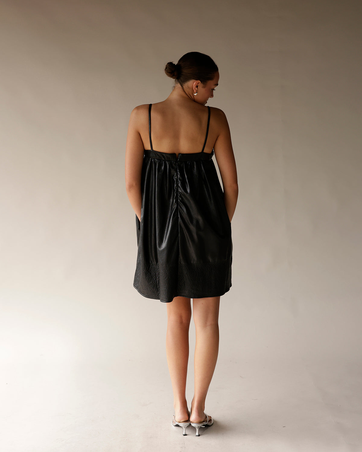 BOW LOVE FAUX LEATHER BLACK MINI DRESS