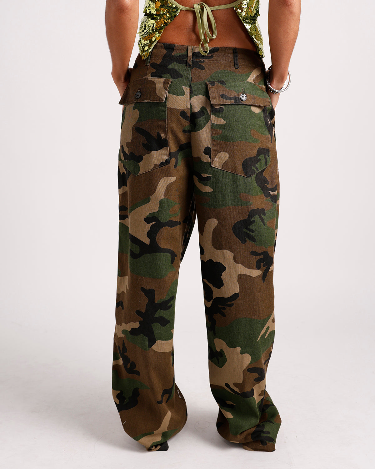 Women's wide-leg camo cargo pants with button flap back pockets, back view