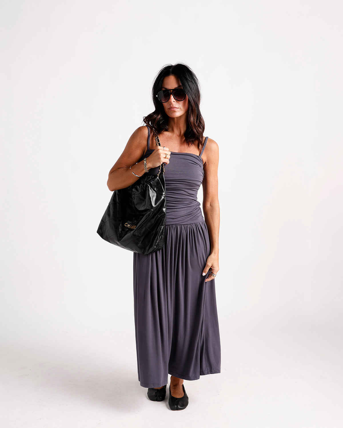 Ruched gray maxi dress with square neckline and gathered skirt, worn with flats