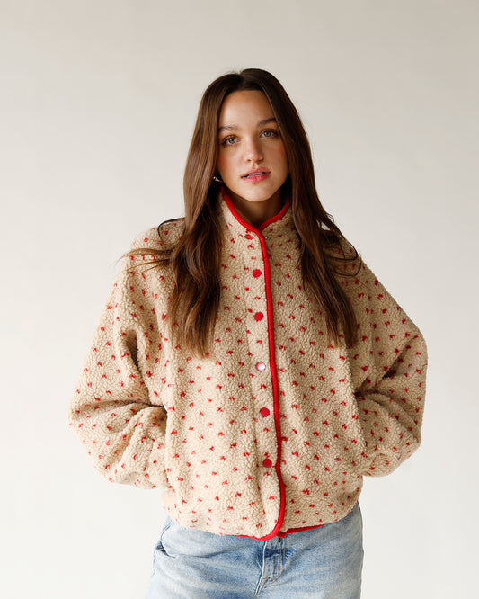 All over red heart printed brown sherpa jacket with red trim