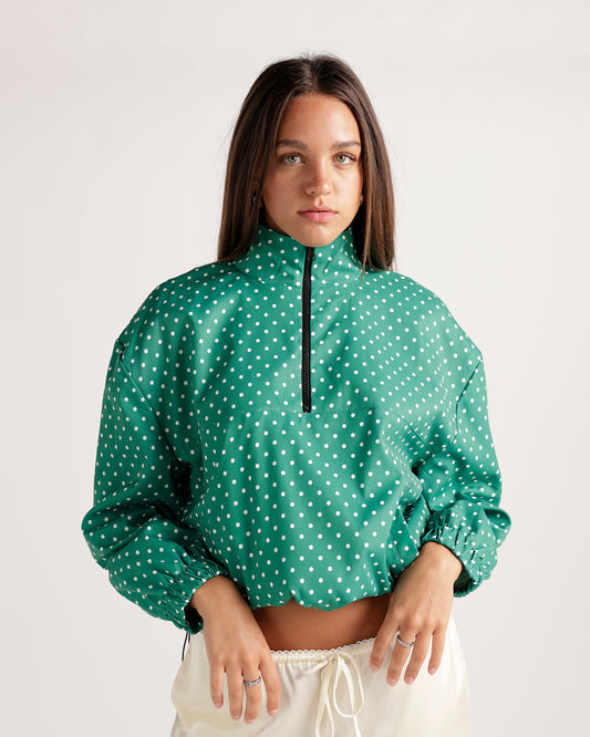 Effortlessly stylish, this green pullover jacket with white polka dot print adds a fun twist to your wardrobe. Versatile and comfortable with a relaxed, boxy fit