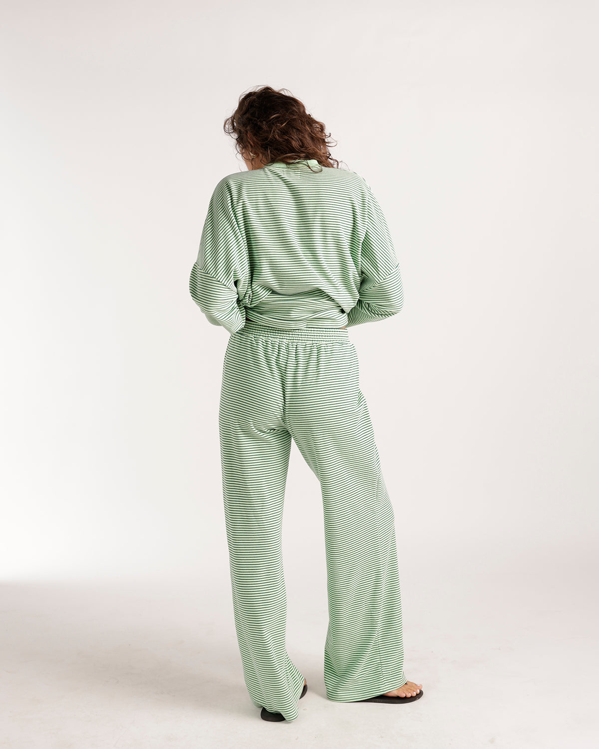 Oversized green and white striped long sleeve top, back view, relaxed fit