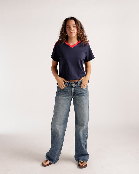 Wide-leg light wash blue denim jeans with a relaxed low-rise fit