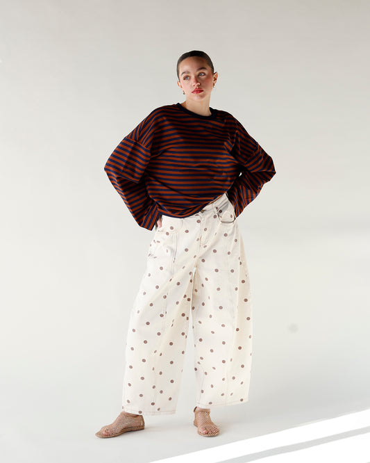 brown and white polka dot print barrel leg jeans