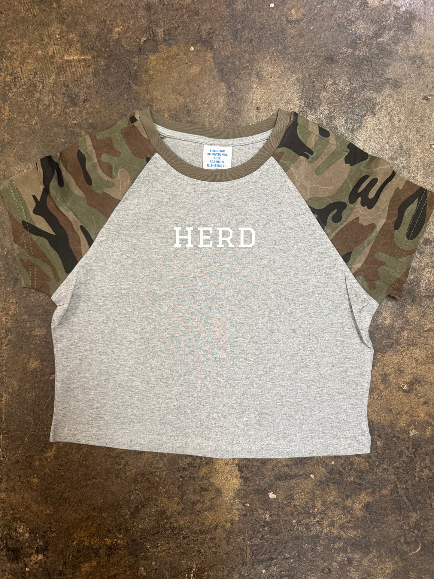 Gray crop raglan tee with camo sleeves and white HERD chest graphic