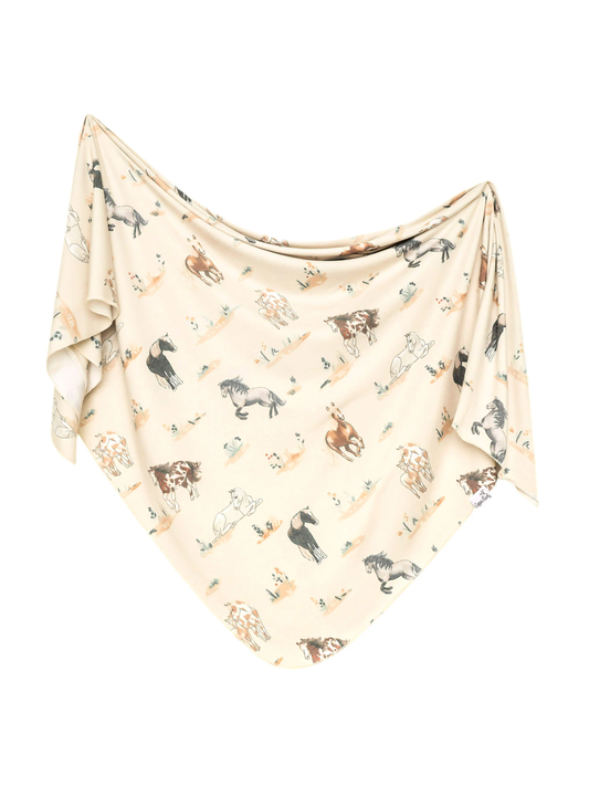 Cream knit swaddle blanket with watercolor wild horse print in brown and gray