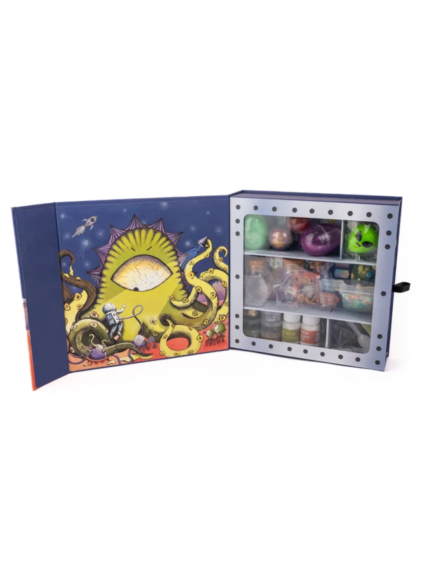 Open box kit with space monster artwork lid and compartments holding potions and toys