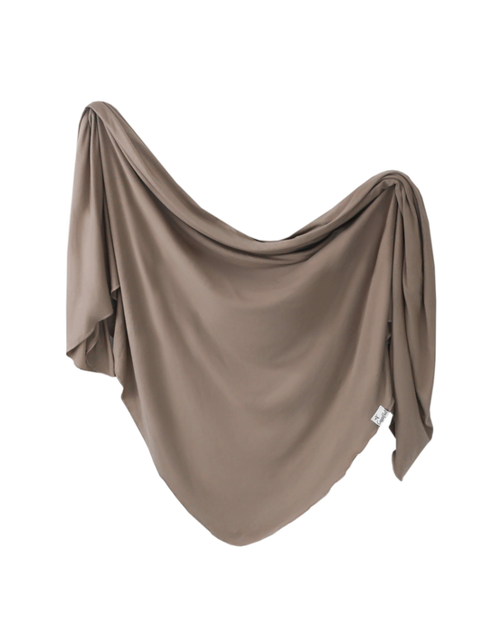 Copper Pearl swaddle blanket in warm taupe draped softly against white background