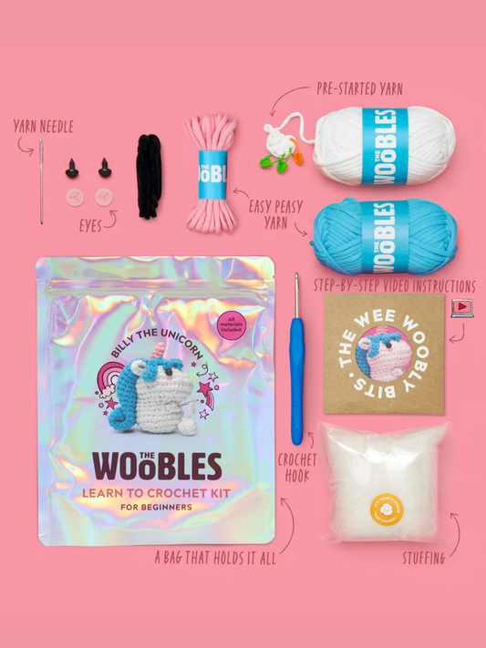 Beginner crochet kit contents: yarn, hook, stuffing, eyes, needle, and instruction booklet