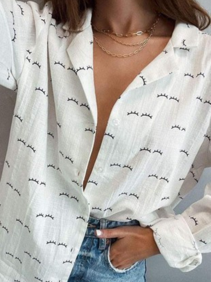 white button up shirt with eyelash print