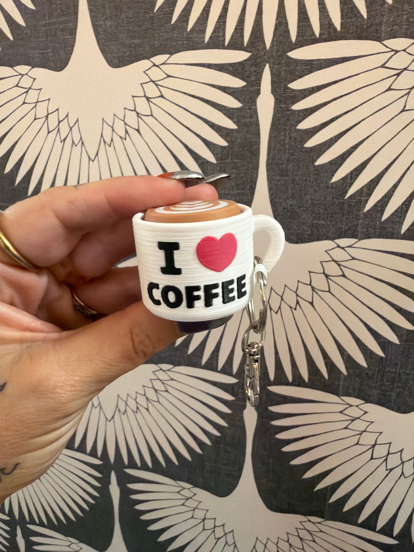 Mini white coffee mug keychain with I Love Coffee text and latte art