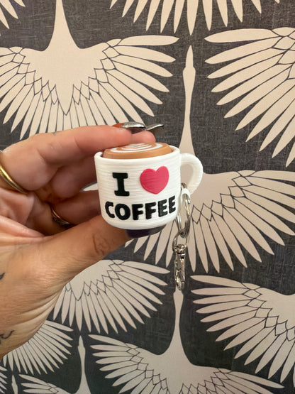 Mini white coffee mug keychain with I Love Coffee text and latte art