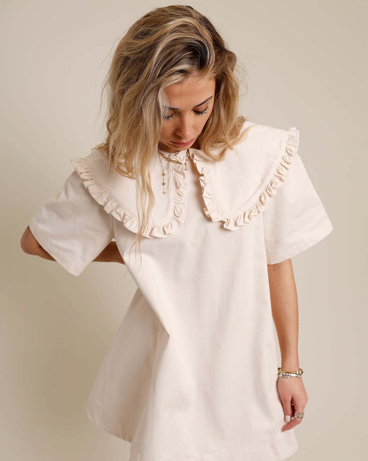 Cream mini dress with oversized ruffle Peter Pan collar and short sleeves