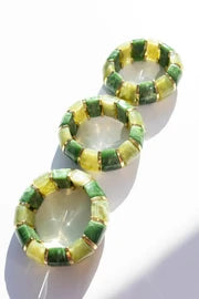 Shop Bibi stretch bangles featuring colorful resin, 18K gold-plated stainless steel accents, and a waterproof, tarnish-resistant design. The perfect stackable bracelet for everyday style.