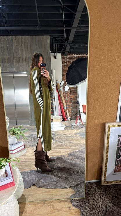 Olive green maxi track dress with white side stripes, long sleeves, side slit