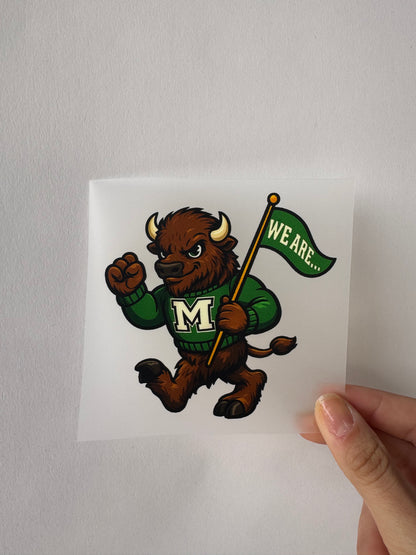 Sticker featuring a bison mascot in green M sweater holding a We Are flag