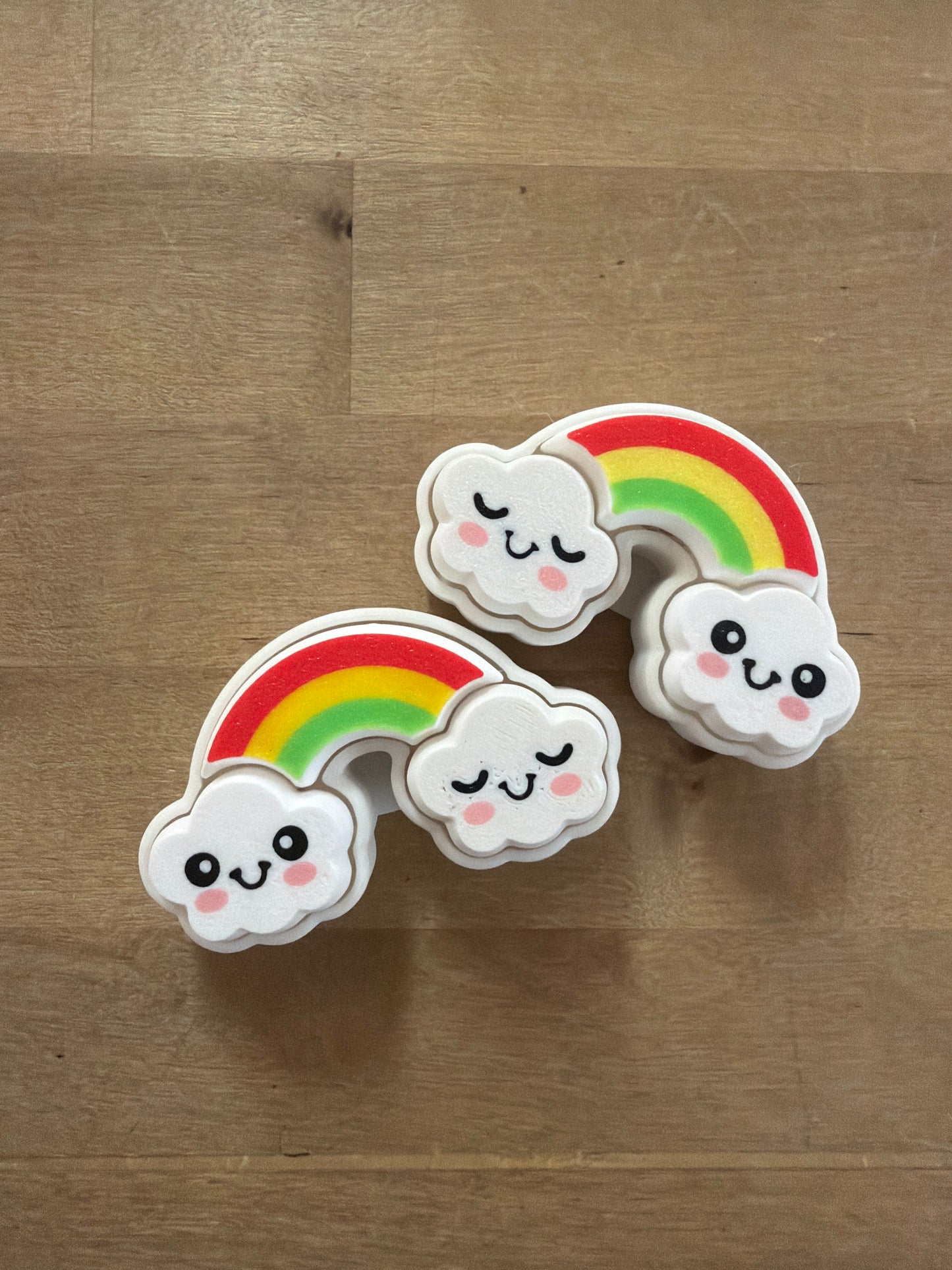 Kawaii rainbow cloud erasers with smiley faces, red yellow green stripes, white foam