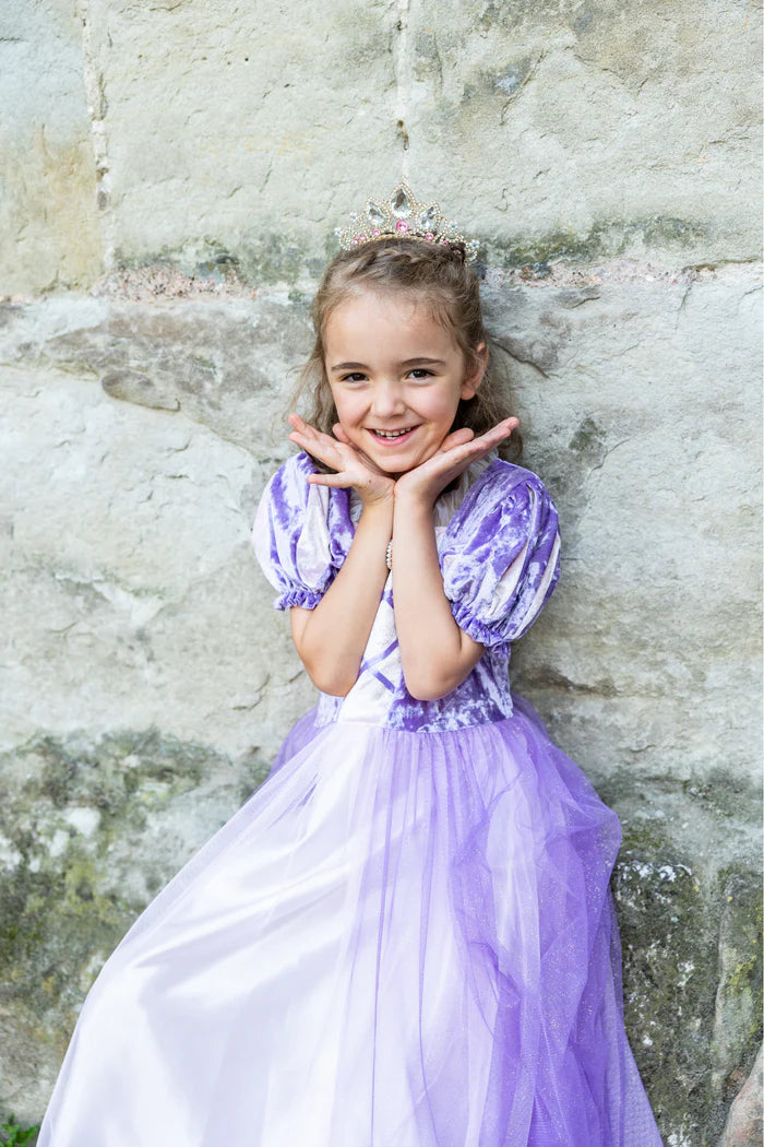 Girl wearing purple velvet and tulle princess dress with sparkly tiara