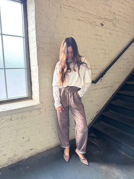 HIP LEANING INTO LEOPARD BARREL JOGGER