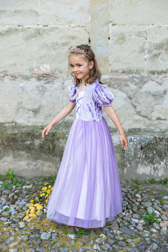 Girl wearing long purple velvet princess dress with tulle skirt and tiara