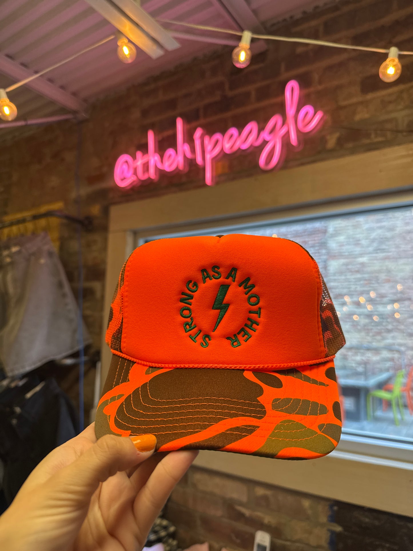 STRONG AS A MOTHER TRUCKER HAT X ORANGE CAMO