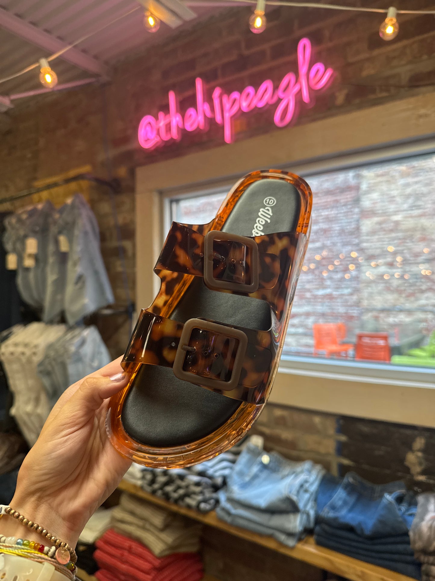 Tortoise print double strap jelly slide sandal with square buckles and black footbed