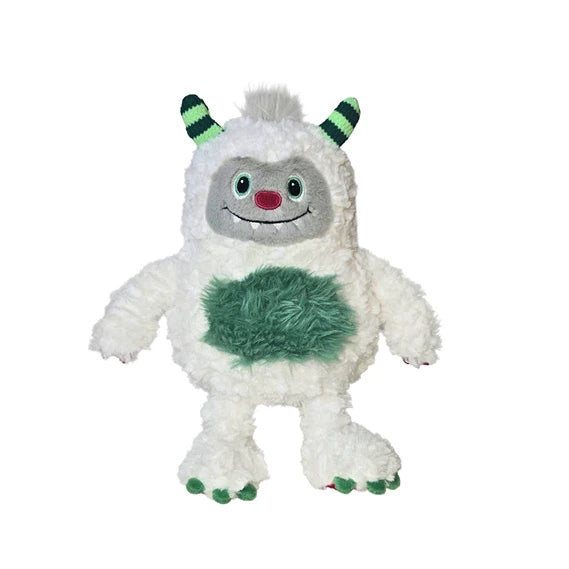 White yeti monster plush toy with green horns, belly patch, and clawed feet