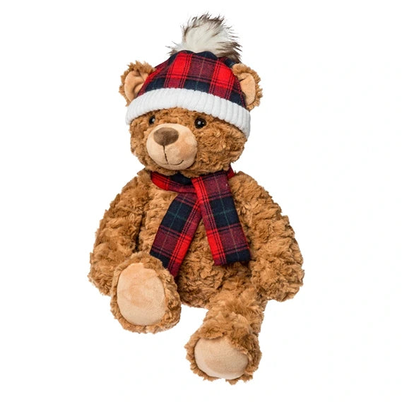 Brown curly plush teddy bear wearing red plaid hat and matching scarf
