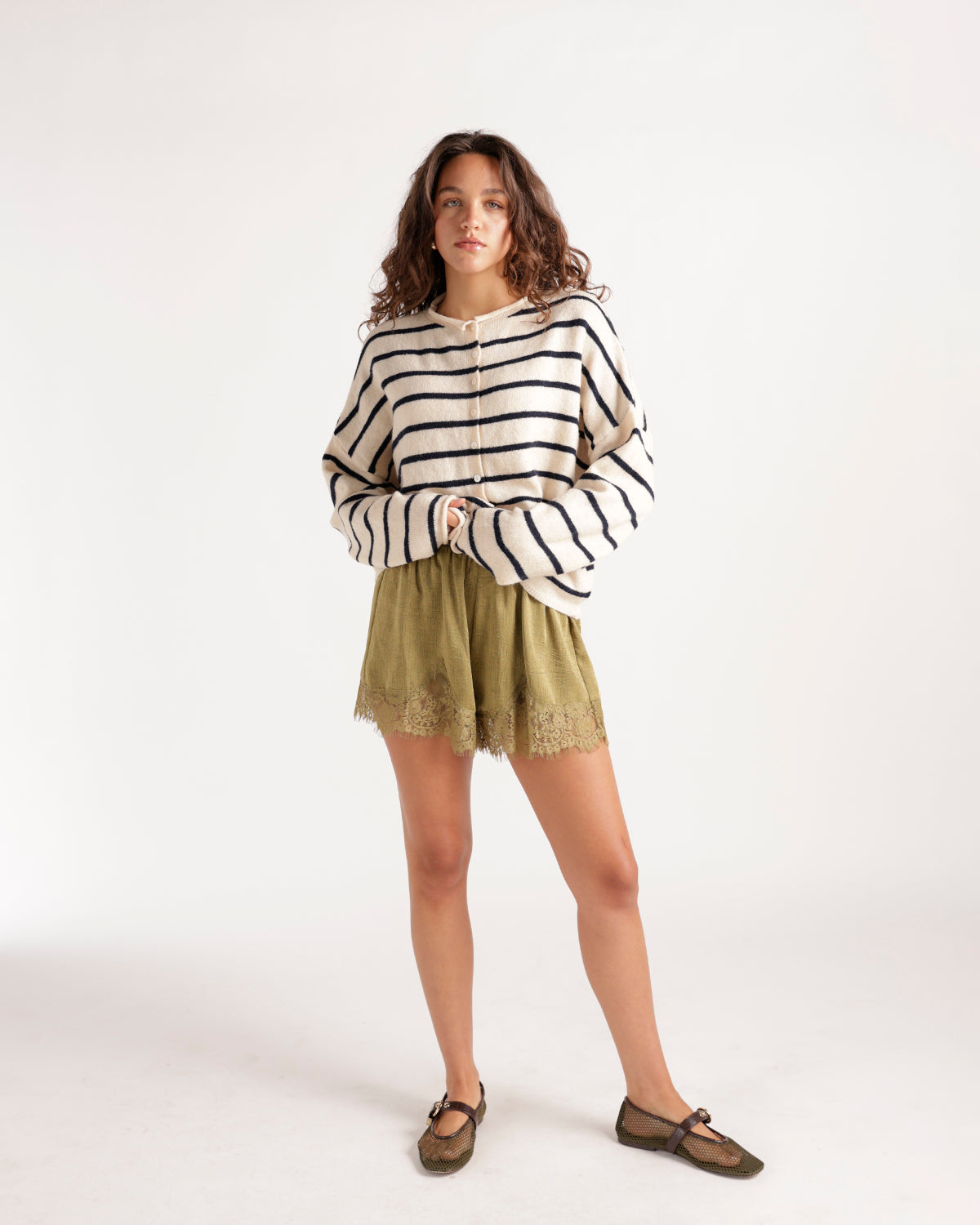Ivory and navy stripe knit cardigan with button front, worn with olive lace shorts