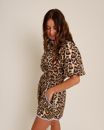 leopard print romper with blue lace trim and pockets