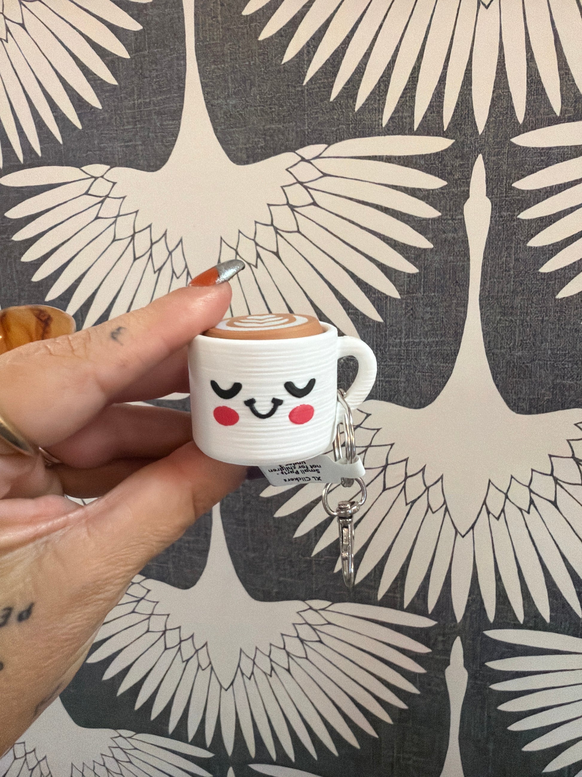 Cute kawaii latte cup keychain charm with smiley face and latte art top