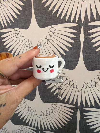 Cute kawaii latte cup keychain charm with smiley face and latte art top