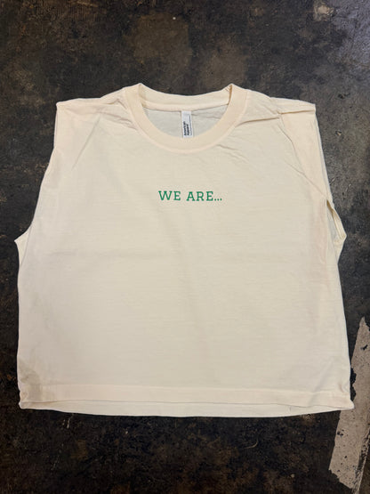 Off-white sleeveless muscle tee with green WE ARE… text on chest