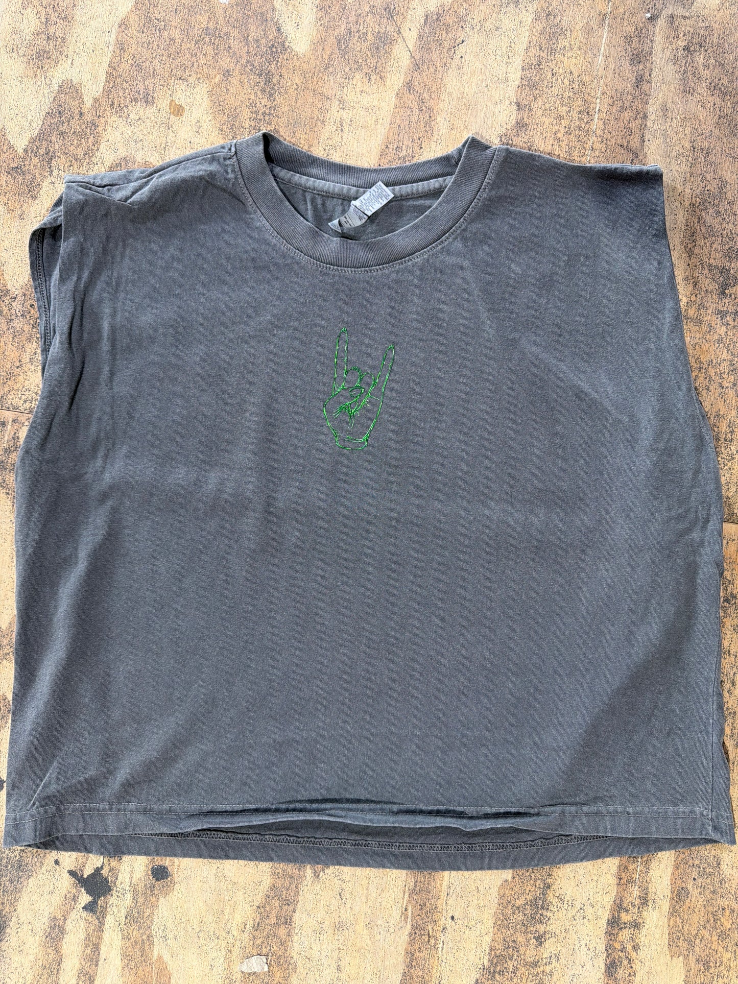 Vintage black sleeveless muscle tee with green embroidered rock hand gesture on chest