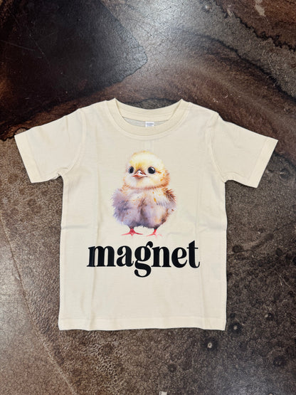 Cream toddler tee with baby chick graphic and word magnet printed below